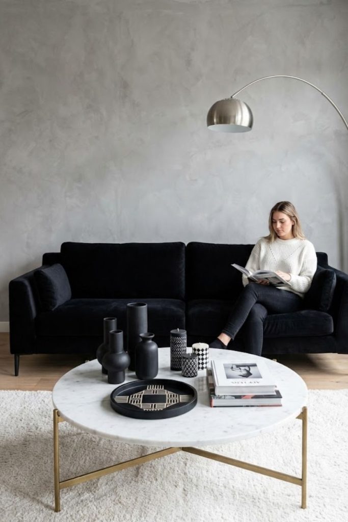 White coffee table with black decor accents