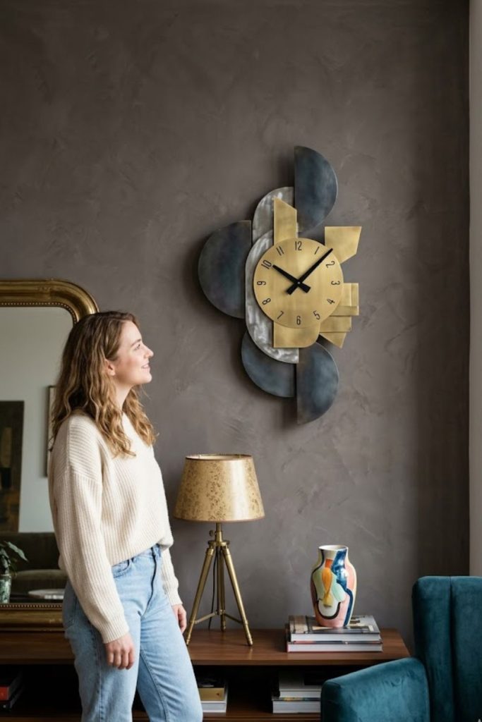 Sculptural clock as functional art in an eclectic room